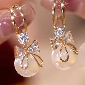 Boucles d'Oreilles Pendantes avec Noeud de Papillon et Perle