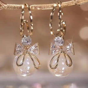 Boucles d'Oreilles Pendantes avec Noeud de Papillon et Perle