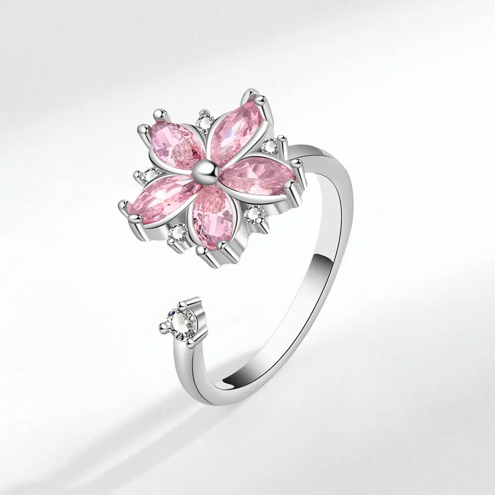 Bague ajustable avec fleur rotative anti-stress en cristaux roses