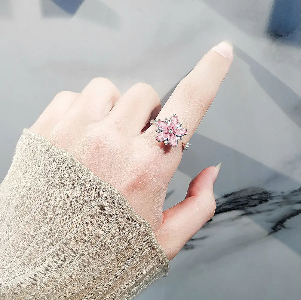 Bague ajustable avec fleur rotative anti-stress en cristaux roses