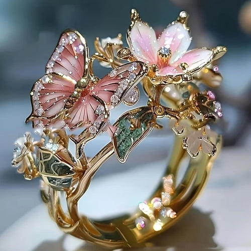 Verstelbare ring met kersenbloesem en vlinder in goud