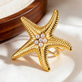 Gouden zeester schelpring