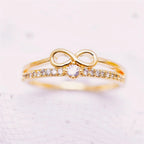 Dubbele ring en oneindigheidssymbool in goud