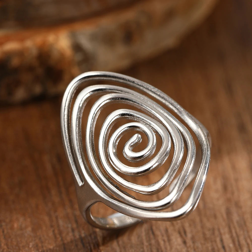 Brede ring in getextureerde spiraalvorm zilver