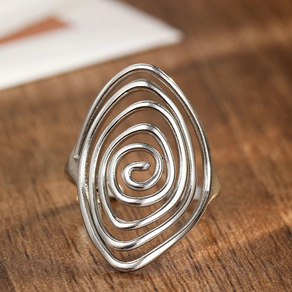 Brede ring in getextureerde spiraalvorm zilver