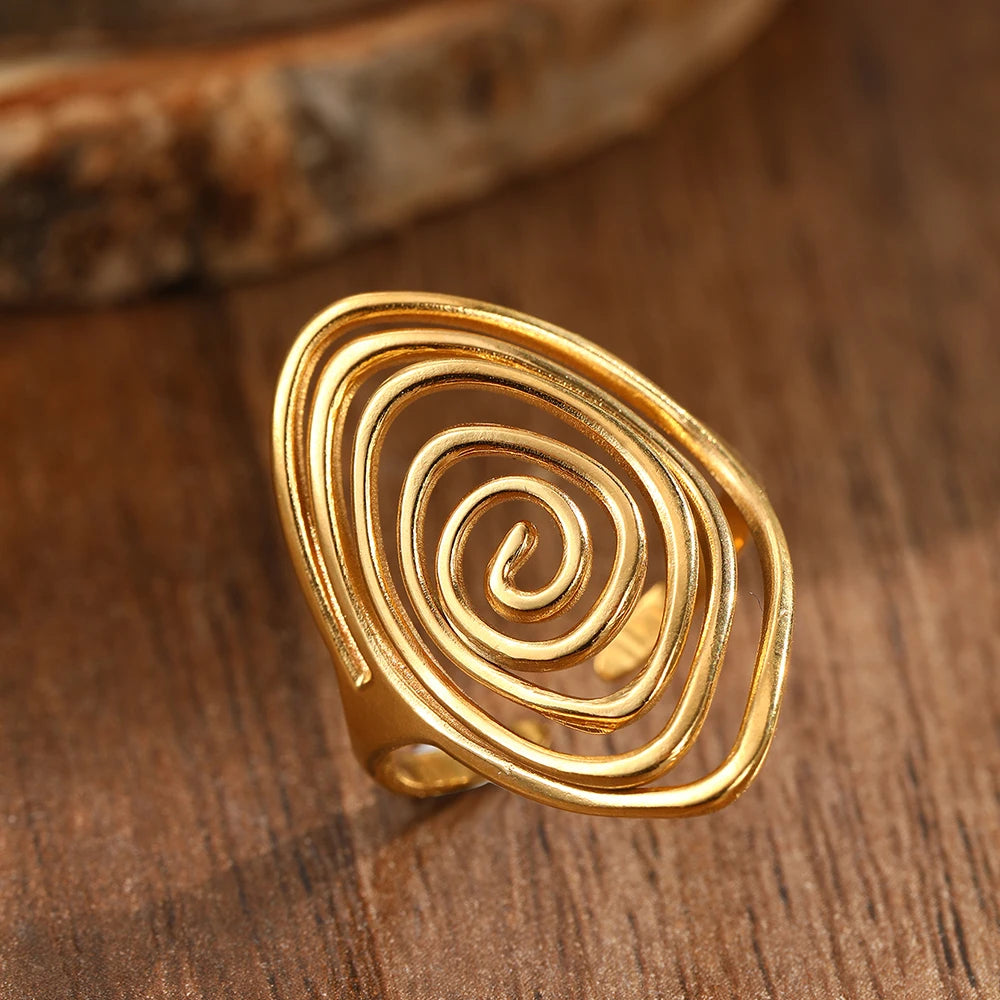 Brede ring in getextureerde spiraalvorm goud
