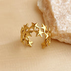 Brede ring met meerdere sterren goud