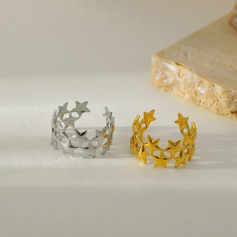Brede ring met meerdere sterren zilver