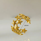 Brede ring met meerdere sterren goud