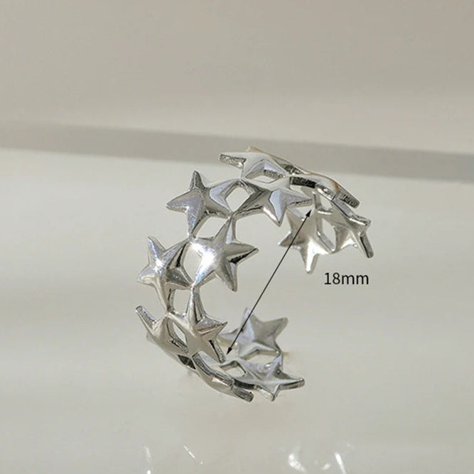 Brede ring met meerdere sterren zilver