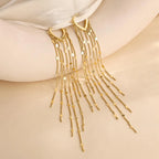 Boucles d'oreilles à pompons sublimant le visage