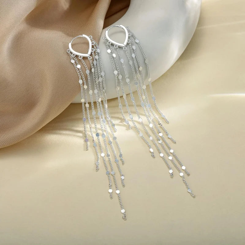 Boucles d'oreilles à pompons sublimant le visage