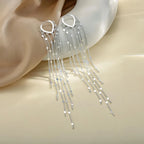 Boucles d'oreilles à pompons sublimant le visage