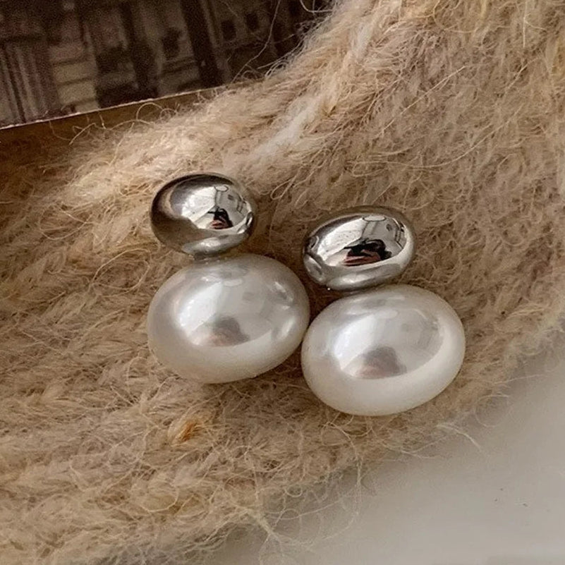 Oorbellen met dubbele zilveren parel