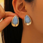 Oorbellen met blauw druppelvormig silhouet 