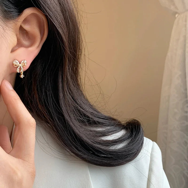 Oorbellen vlinderstrik vrouw goud