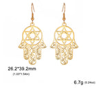Hangende oorbellen met het Joodse beschermingssymbool hand van Fatma en <span data-glossary-id="etoile-de-david">Davidsster</span> 