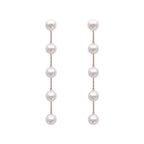 Boucles d'Oreilles Pendantes avec Perles Blanches