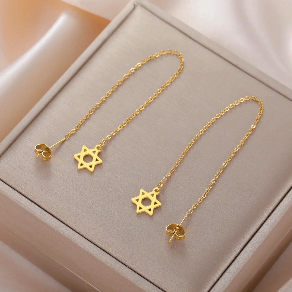 Lange hangende oorbellen met de <span data-glossary-id="star-of-david">Davidster</span> joods symbool goud