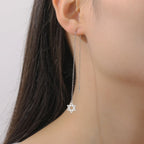 Lange hangende oorbellen met de <span data-glossary-id="star-of-david">Davidster</span> joods symbool zilver