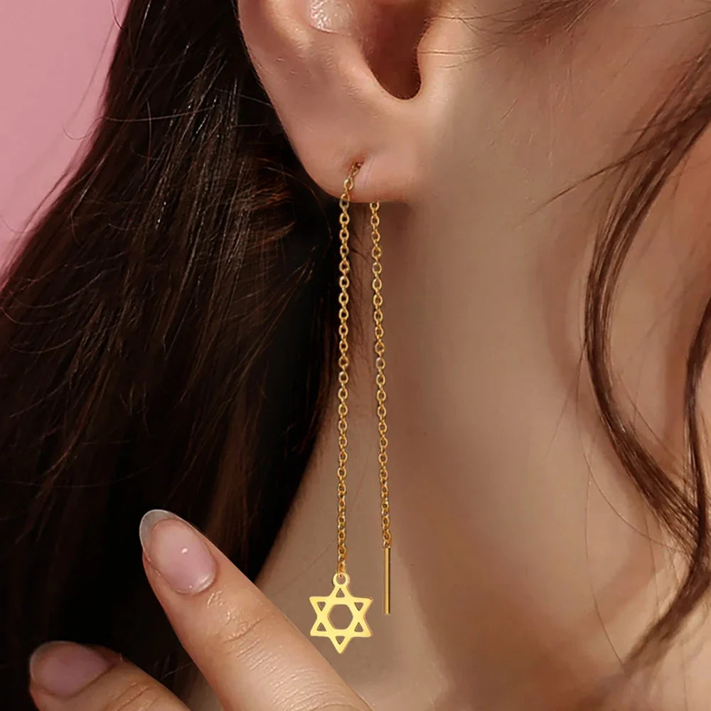 Lange hangende oorbellen met de <span data-glossary-id="star-of-david">Davidster</span> joods symbool goud