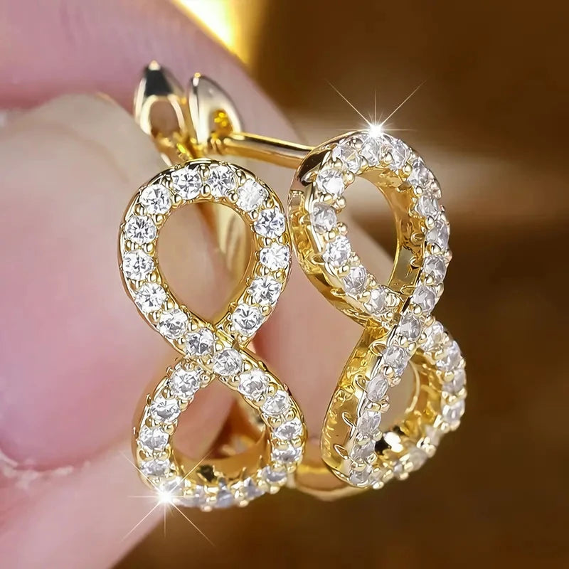 Hangende oorbellen met sprankelend oneindigheidssymbool goud