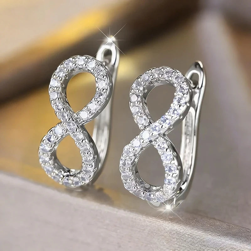 Hangende oorbellen met sprankelend oneindigheidssymbool zilver