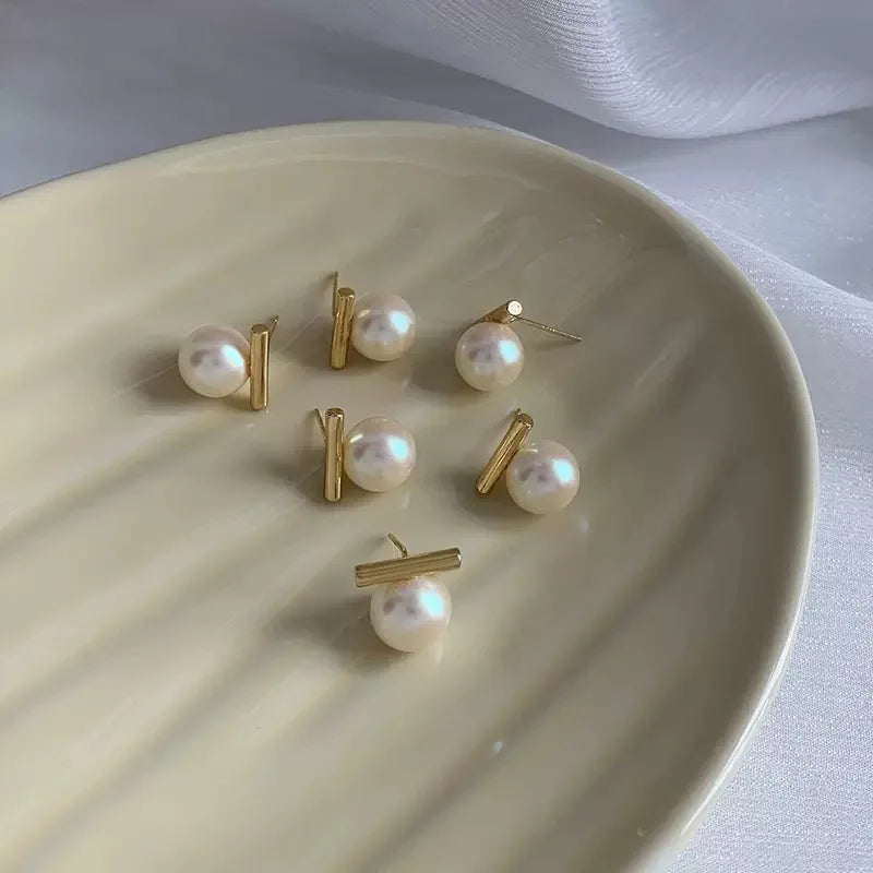 Parel oorbellen met geometrische staaf