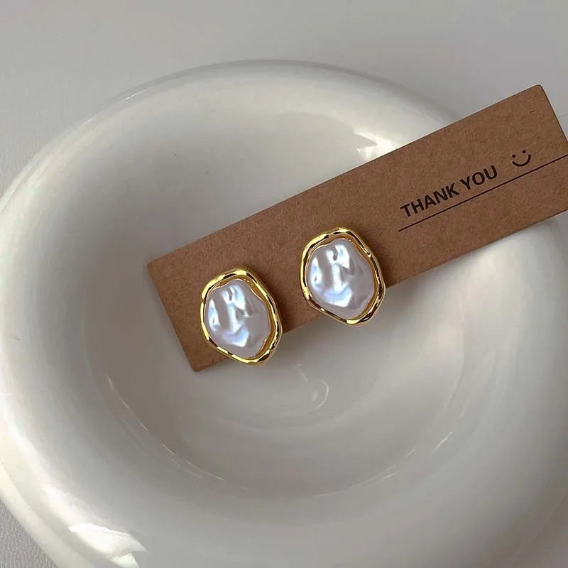 Oorbellen met geometrische parel goud