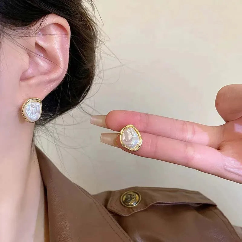 Oorbellen met geometrische parel goud