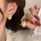 Oorbellen met geometrische parel goud
