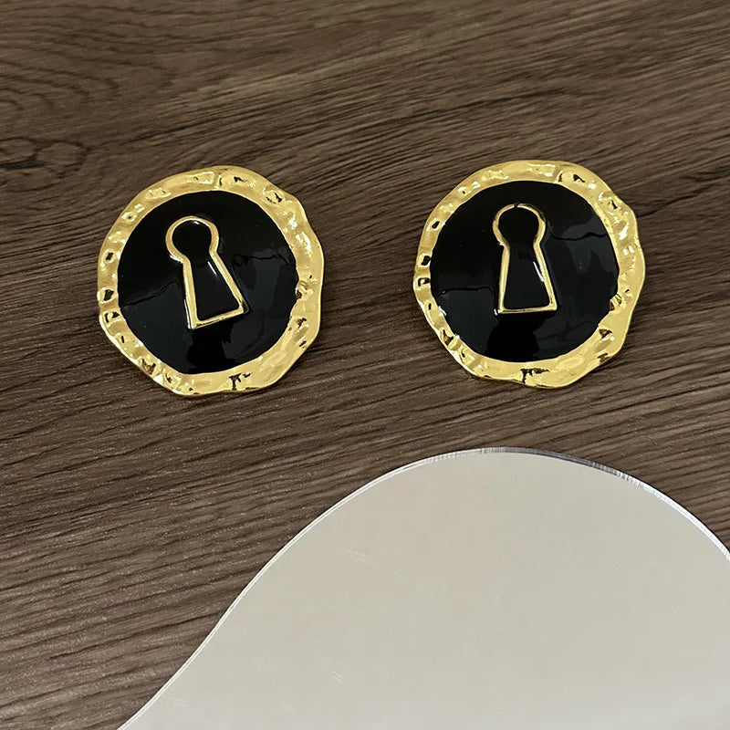 Ronde oorbellen sleutel zwart