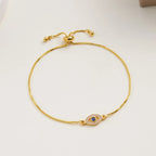 Verstelbare armband met blauw oog versierd met strass