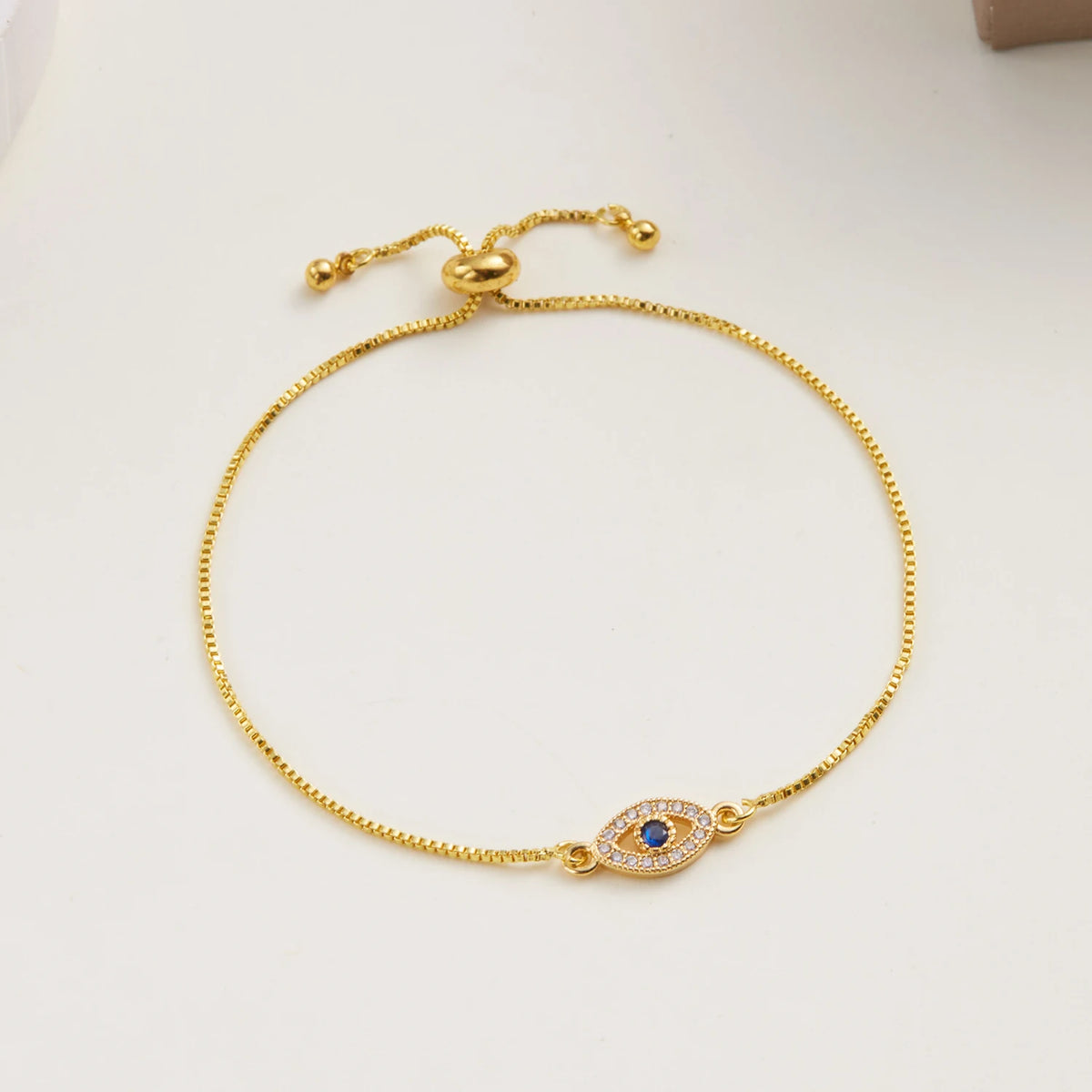 Verstelbare armband met blauw oog versierd met strass