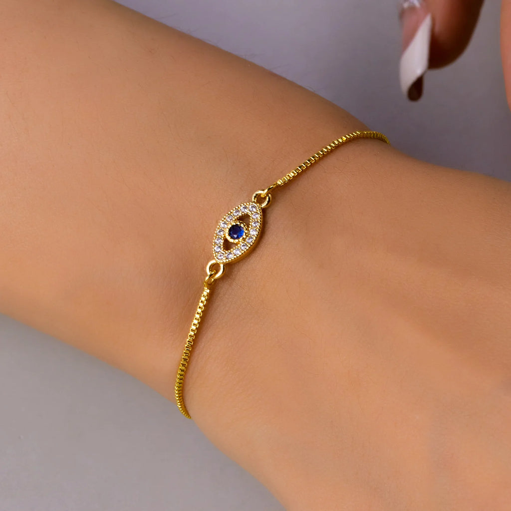 Verstelbare armband met blauw oog versierd met strass