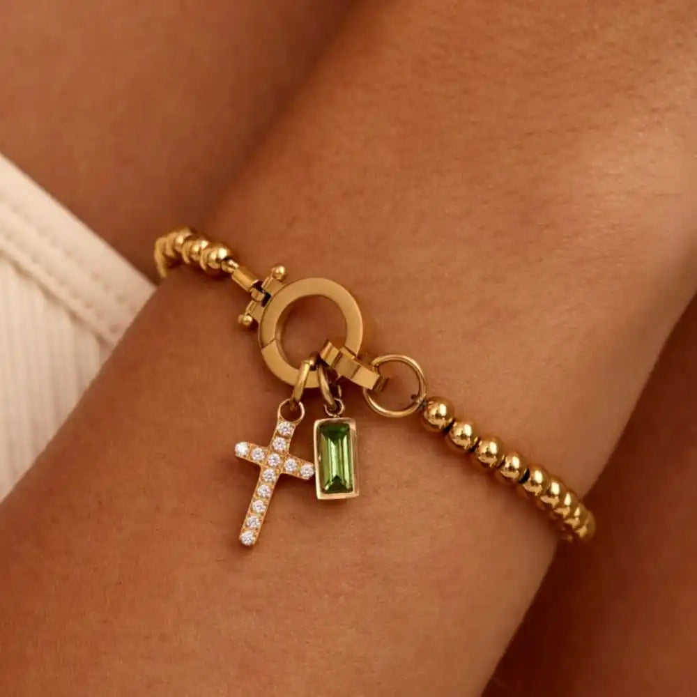 Armband met kruis en geboortesteen van december