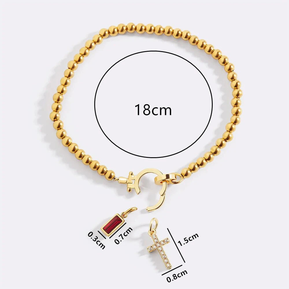 Armband met kruis en geboortesteen