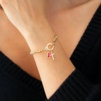 Armband met kruis en geboortesteen