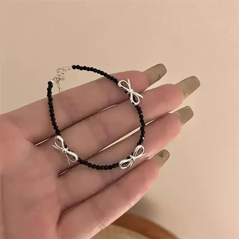 Armband met vlinderdas voor dames zwart
