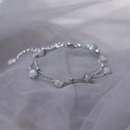 Armband met maansteen kralen met iriserende reflecties