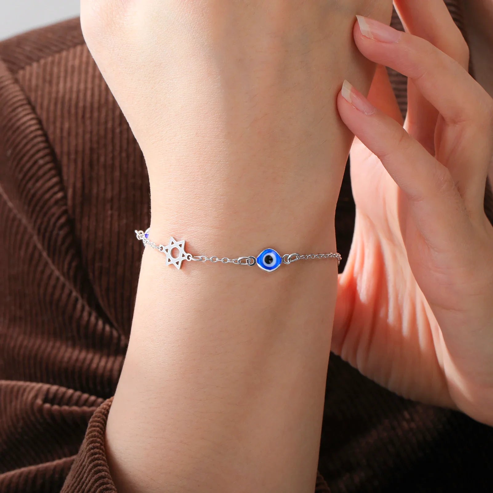 Armband met beschermsymbolen blauwe oog, Chai en de Davidster zilver