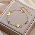 Armband met beschermsymbolen blauwe oog, Chai en de Davidster goud