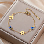 Armband met beschermsymbolen blauwe oog, Chai en de Davidster goud