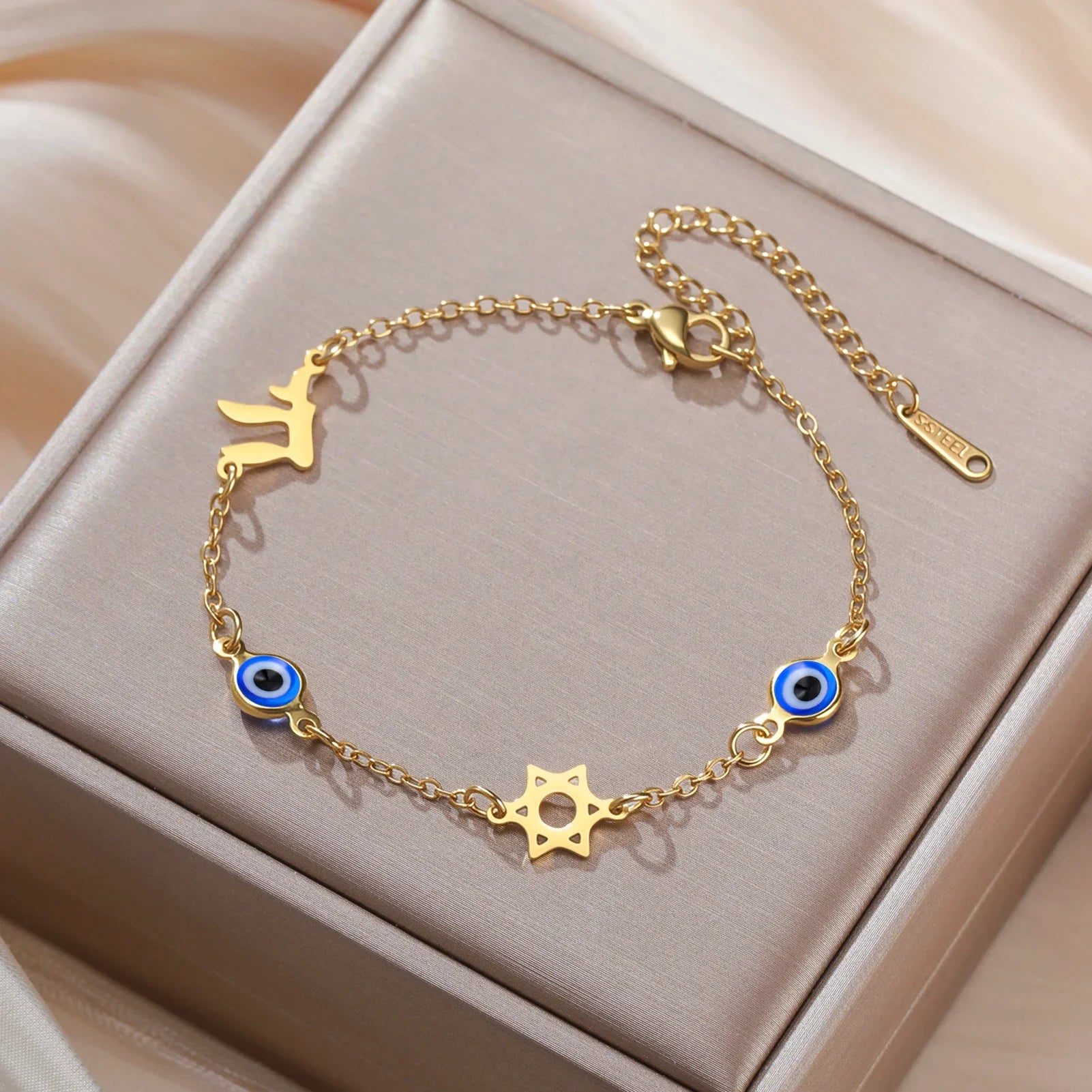 Armband met beschermsymbolen blauwe oog, Chai en de Davidster goud