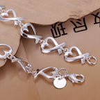 Armband met oneindigheidssymbolen in de vorm van een hart 