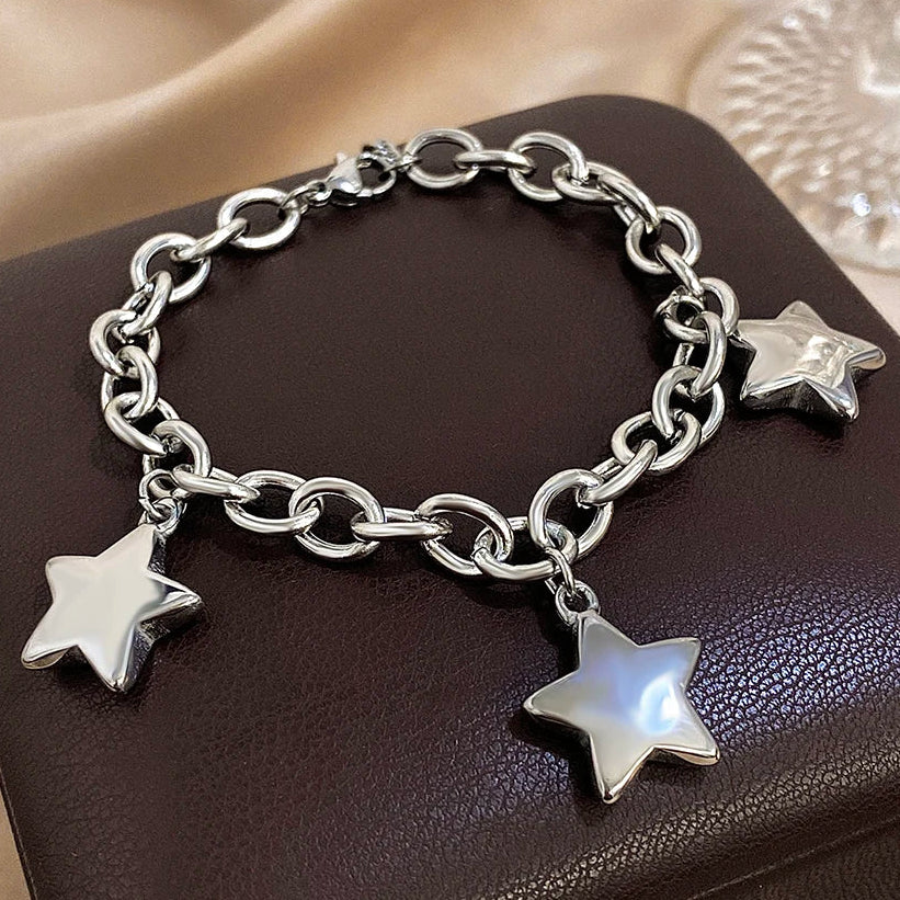 Armband met drie hangende sterren zilver