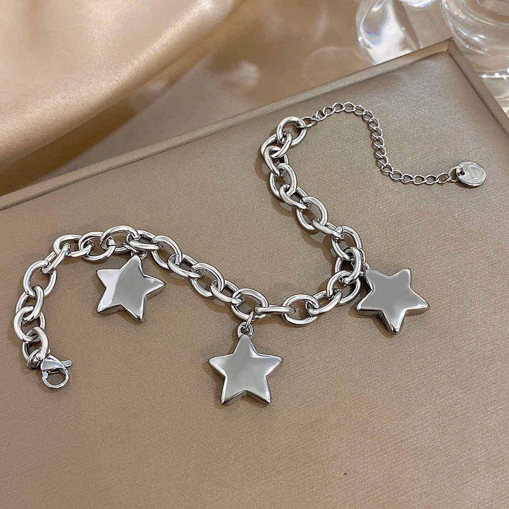 Armband met drie hangende sterren zilver