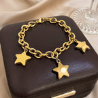Armband met drie hangende sterren goud