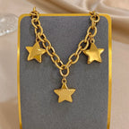 Armband met drie hangende sterren goud