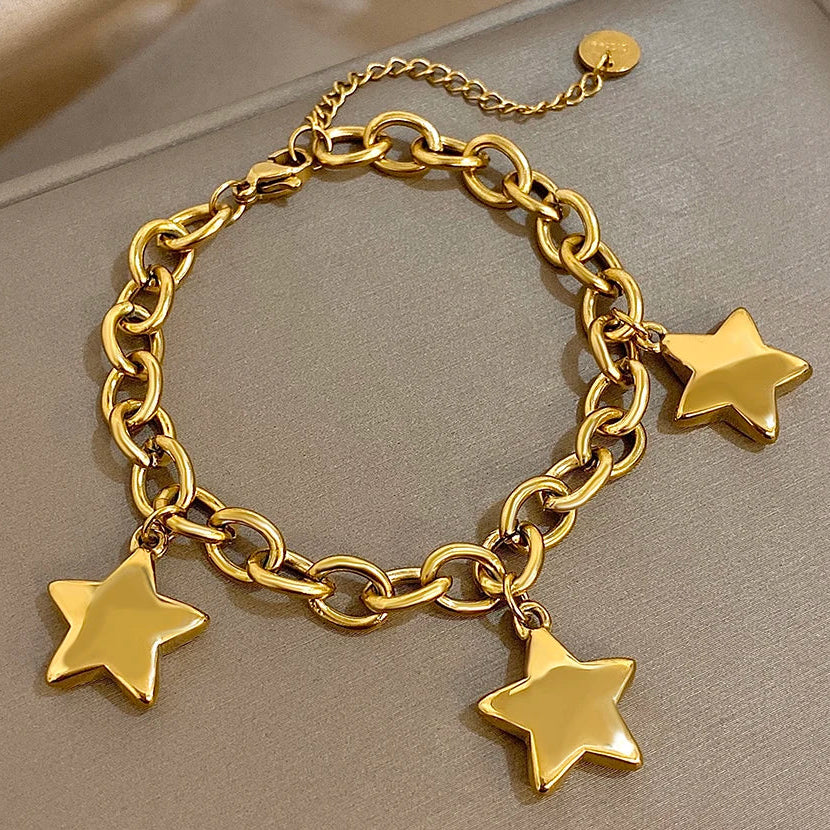 Armband met drie hangende sterren goud